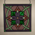 Stained glass panel with a purple flower design on a beige background