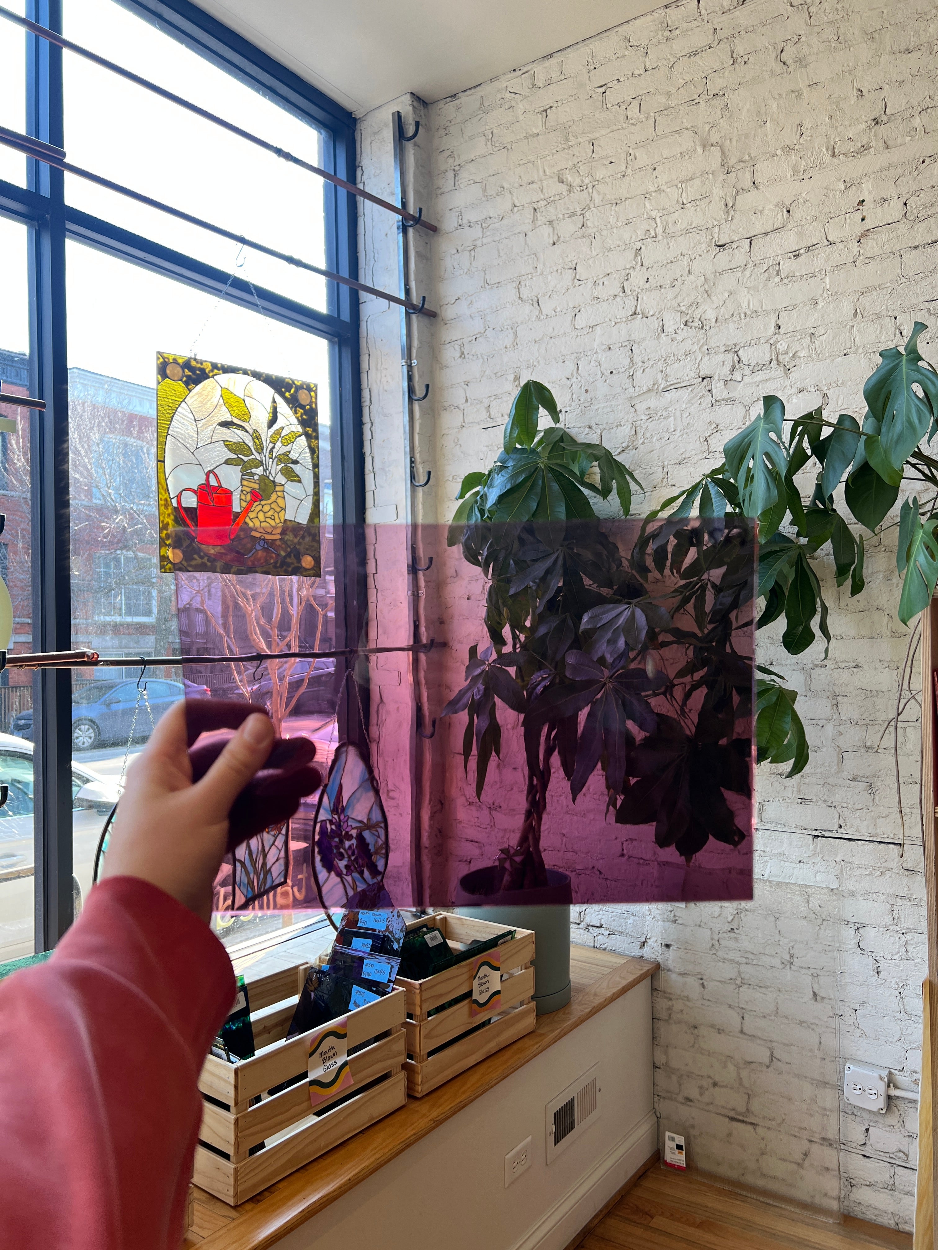Sheet of transparent purple glass in an interior setting 