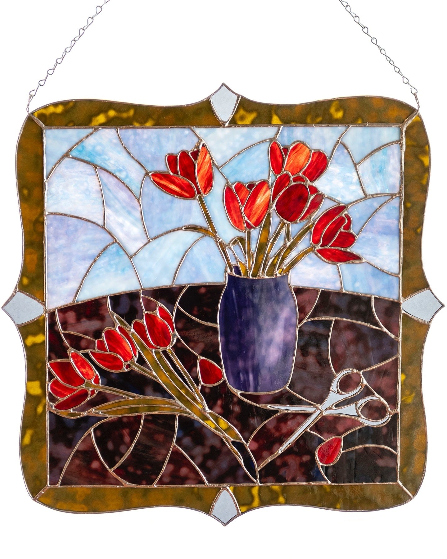 Stained glass panel with red tulips and a purple vase on a white background