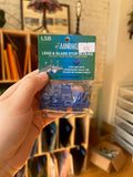 Hand holding a package of lead and glass stop blocks with a visible label.